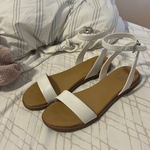Cute flats with white straps that would be good for any summer or formal event.